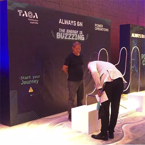 Giant Buzz Wire rental in Dubai with custom branding and wire shape for corporate events, brand activations, and carnival games in the UAE