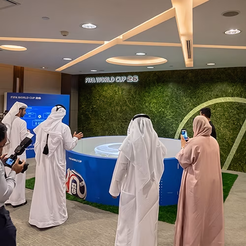 Custom-branded Interactive Football Arena setup at a Dubai exhibition venue with an electronic leaderboard for competition