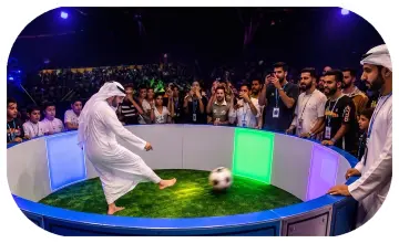 Custom-branded Interactive Football Arena setup at a Dubai exhibition venue with an electronic leaderboard for competition