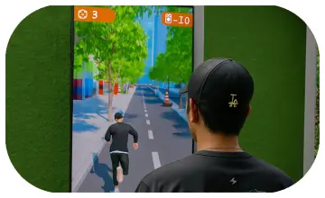Player enjoying a motion runner game in Dubai, using full-body movement to jump and dodge obstacles. Interactive game rental