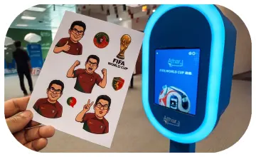 Guest holding a custom-printed sheet of branded AI branded stickers at a Dubai corporate event