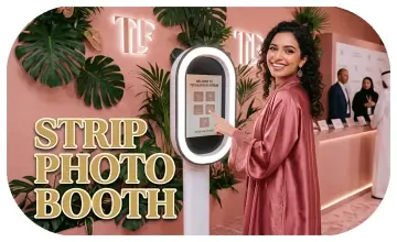 Guests having fun with quirky props inside a vintage strip photo booth by Mirror Booth Dubai.